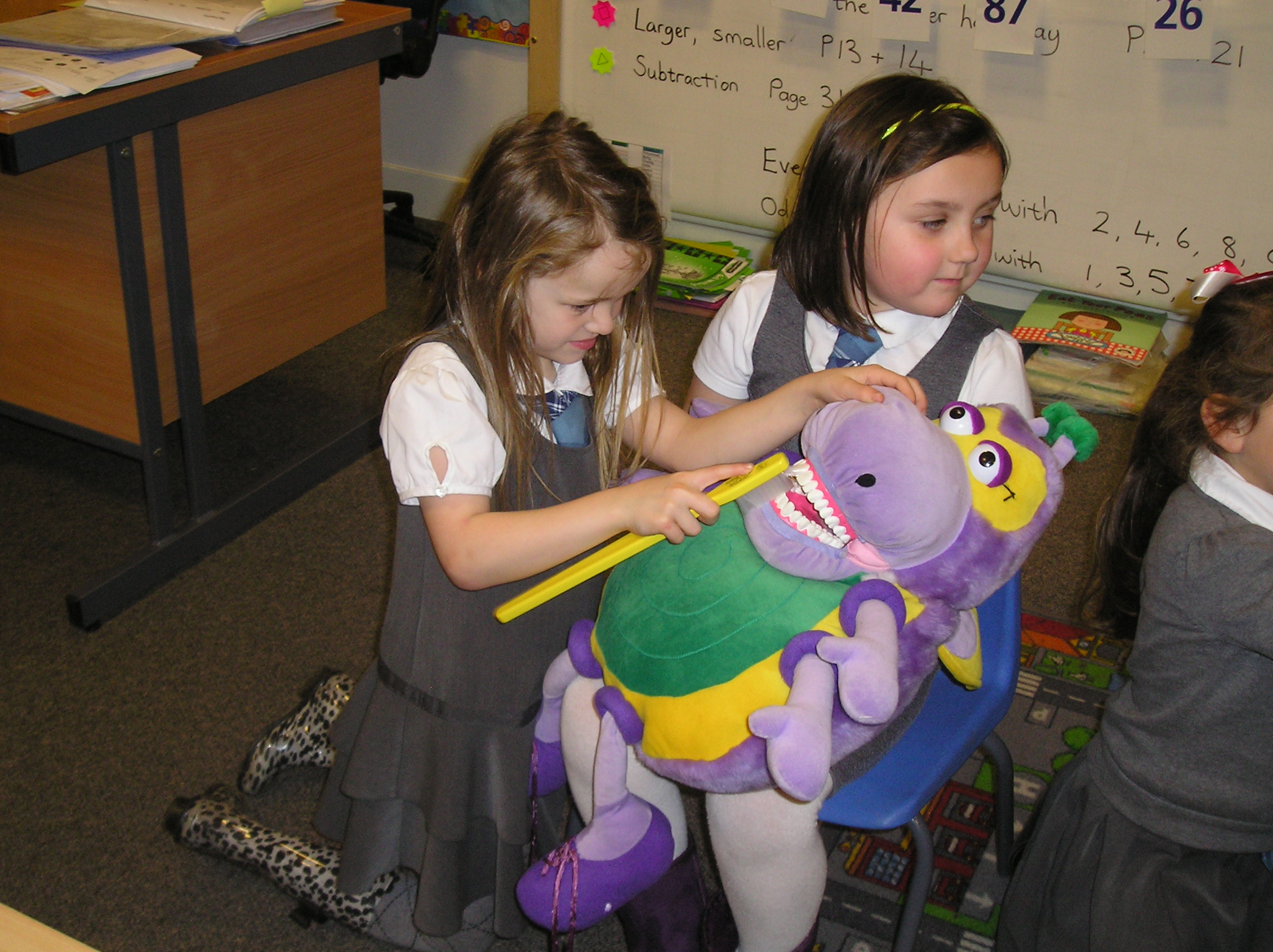 Learning how to brush our teeth properly.